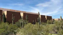 Arizona Heritage Center building with cactus and saguaro cactus.
