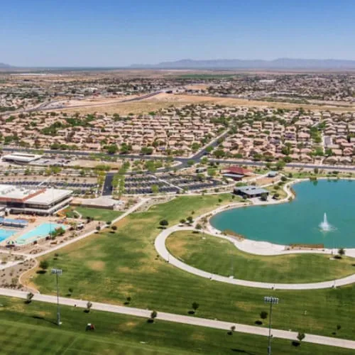 An aerial view of a park with a pond in Maricopa, Arizona.