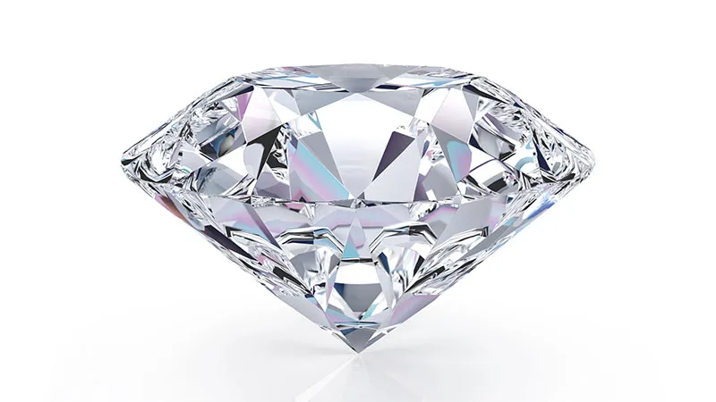 A clear, round-cut diamond is displayed against a plain white background, showing its facets and light reflections.